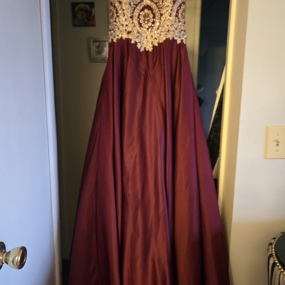 Betsy & Adam Burgundy Ball Gown with Gold Embellished Bodice